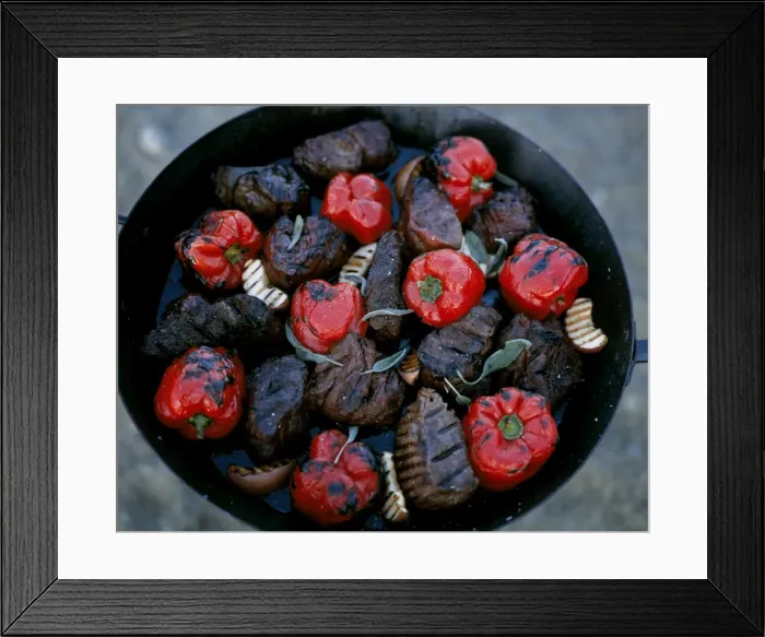 Framed Print : Thick steaks and whole red peppers cooked on an open fire at Kwandwe Lodge Framed Print : Thick steaks and whole red peppers cooked on an open fire at Kwandwe Lodge