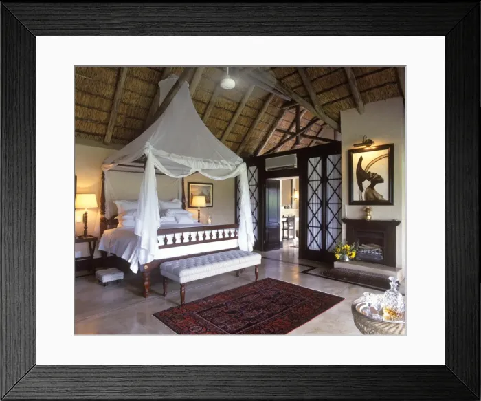 Framed Print : Luxuriously appointed bedroom in one of Framed Print : Luxuriously appointed bedroom in one of