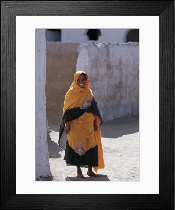 Framed Print : Nubian women wear bright dresses and headscarves even though they are Muslims Framed Print : Nubian women wear bright dresses and headscarves even though they are Muslims