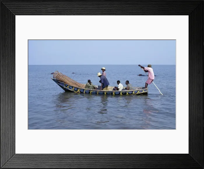 Framed Print : A wooden fishing boat with fish traps in the bow leaves Rwenshama Framed Print : A wooden fishing boat with fish traps in the bow leaves Rwenshama