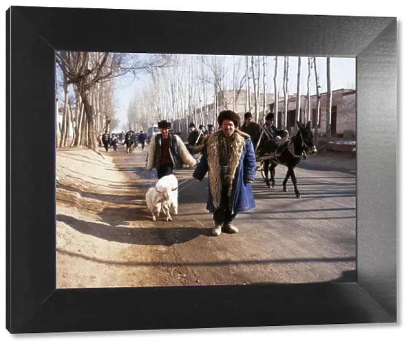 Uighur man with sheep on the road to Kashgar market