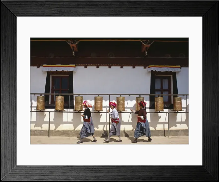 Framed Print : Mosu women push prayer wheels at a small monastery on Liwubi Island Framed Print : Mosu women push prayer wheels at a small monastery on Liwubi Island