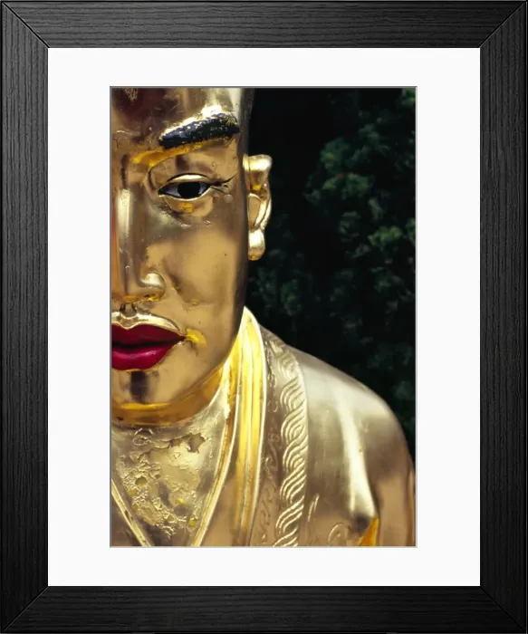 Framed Print : Face of a golden Buddha statue - one among many Framed Print : Face of a golden Buddha statue - one among many