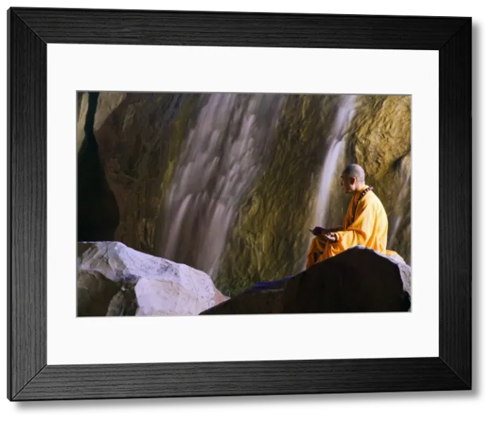 Framed Print : A monk demonstrating meditation at the Zen Music Shaolin