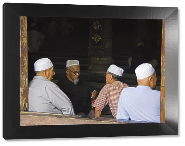 Men in the prayer hall at The Great Mosque located
