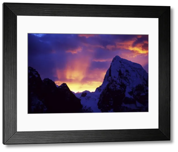 Framed Print : Rays of sunlight illuminate the clouds over the mountains Framed Print : Rays of sunlight illuminate the clouds over the mountains