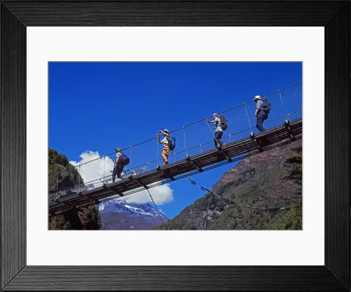 Framed Print : Trekkers crossing a suspension bridge over the Dudh Kosi river Framed Print : Trekkers crossing a suspension bridge over the Dudh Kosi river