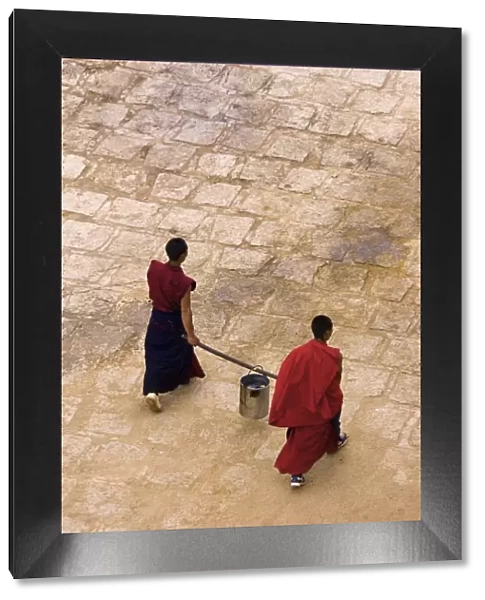 Monks carrying yak butter, Ganden Monastery, Tagtse county, Tibet