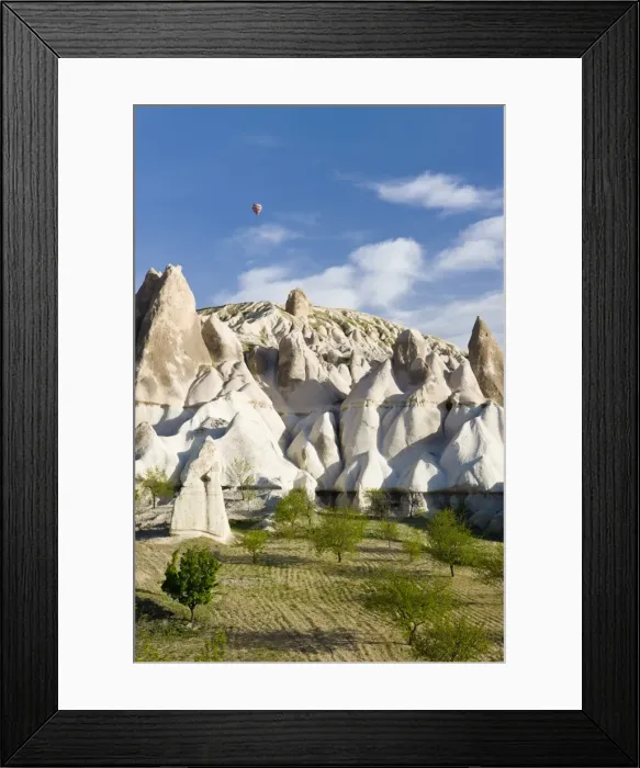 Framed Print : Hot Air balloon over rock Tufa formaions (Fairy Chimneys)