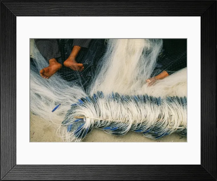 Framed Print : Detail of feet being used to repair fishing Framed Print : Detail of feet being used to repair fishing