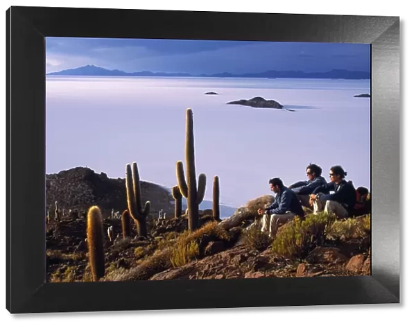 Tourists enjoy the view from the top of Isla de Pescado