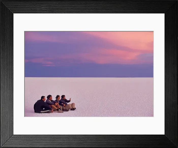 Framed Print : A group of tourists sit on the great expanse of salt Framed Print : A group of tourists sit on the great expanse of salt