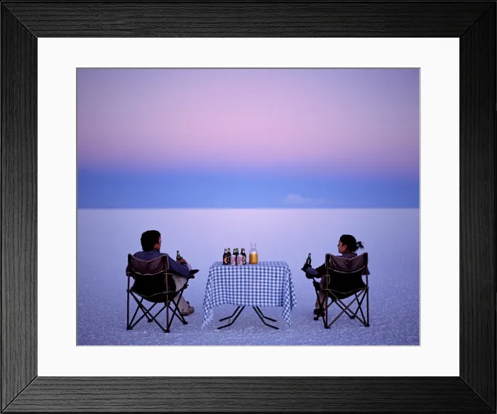 Framed Print : Tourists enjoy sundowners while looking out across Framed Print : Tourists enjoy sundowners while looking out across
