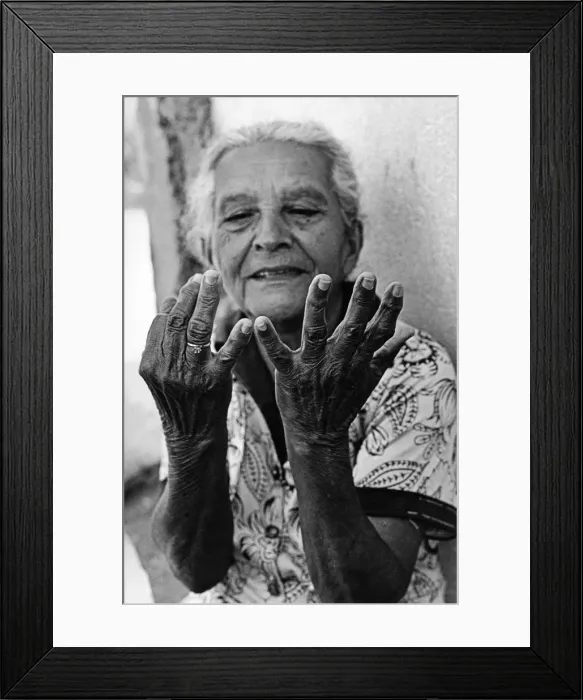 Framed Print : An old woman counts out her age on her fingers Framed Print : An old woman counts out her age on her fingers