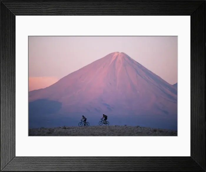 Framed Print : Mountain biking in the Atacama Desert against a backdrop Framed Print : Mountain biking in the Atacama Desert against a backdrop