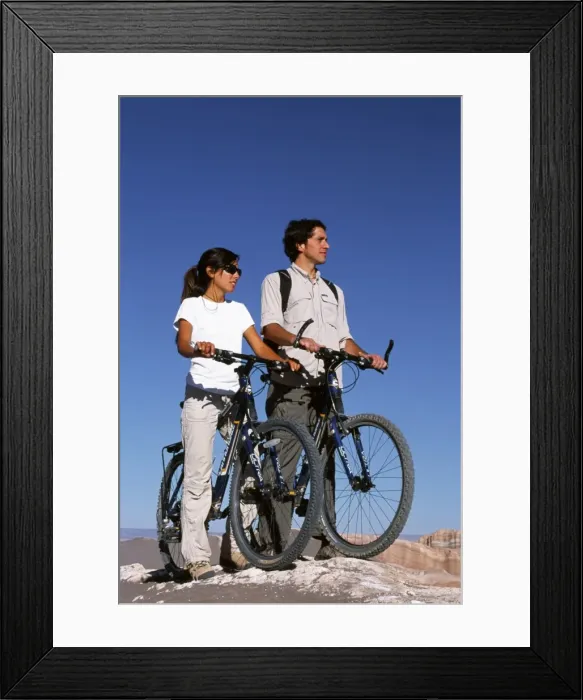 Framed Print : Mountain biking amidst the wind-eroded peaks and lunar landscape of Moon Valley