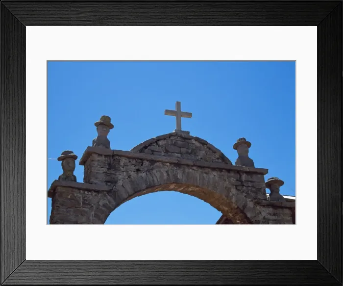 Framed Print : Carved heads of local officials decorate archway leading into plaza Framed Print : Carved heads of local officials decorate archway leading into plaza