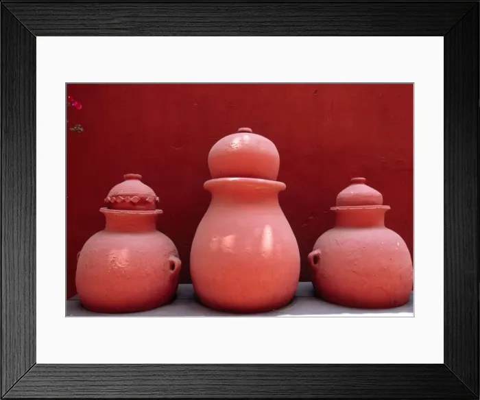 Framed Print : Bouganvillea and painted earth jars decorate a garden Framed Print : Bouganvillea and painted earth jars decorate a garden