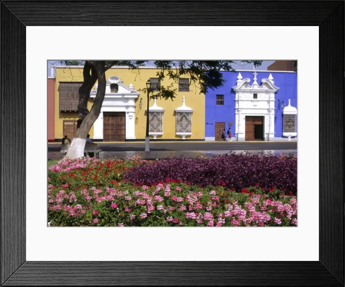 Framed Print : Pastel shades and wrought iron grillwork dominate Framed Print : Pastel shades and wrought iron grillwork dominate