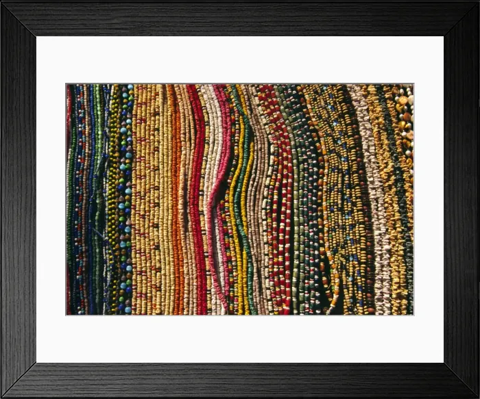Framed Print : Strings of colourful beads are laid out for sale Framed Print : Strings of colourful beads are laid out for sale