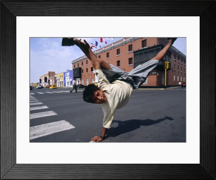 Framed Print : A youth performs an armstand on the streets of Trujillo Framed Print : A youth performs an armstand on the streets of Trujillo