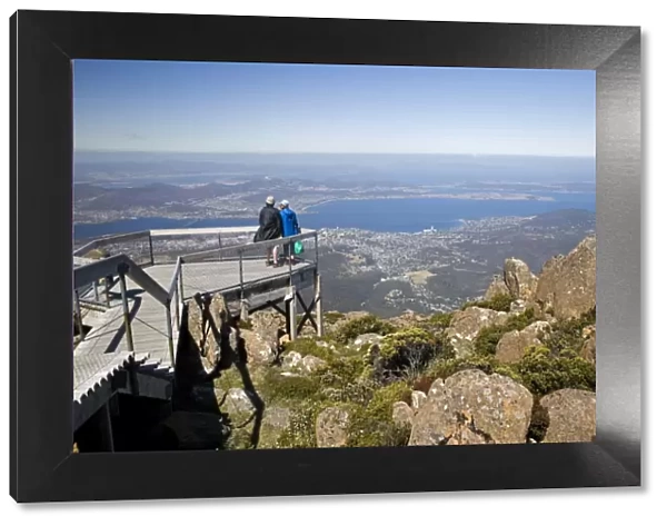 Tourists take in the spectaular view of Hobart from