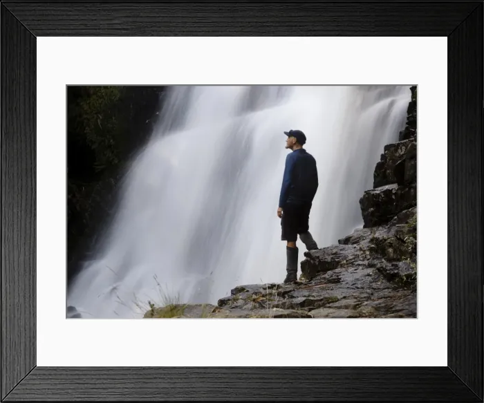 Framed Print : A hiker enjoys Fergusson Falls on the Overland Track