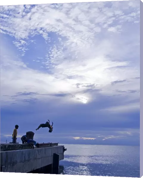 Local Children diving off pier