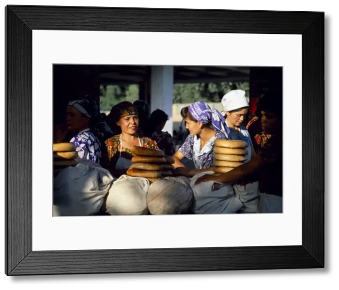 Framed Print : Uzbek women at a bread stall in the market