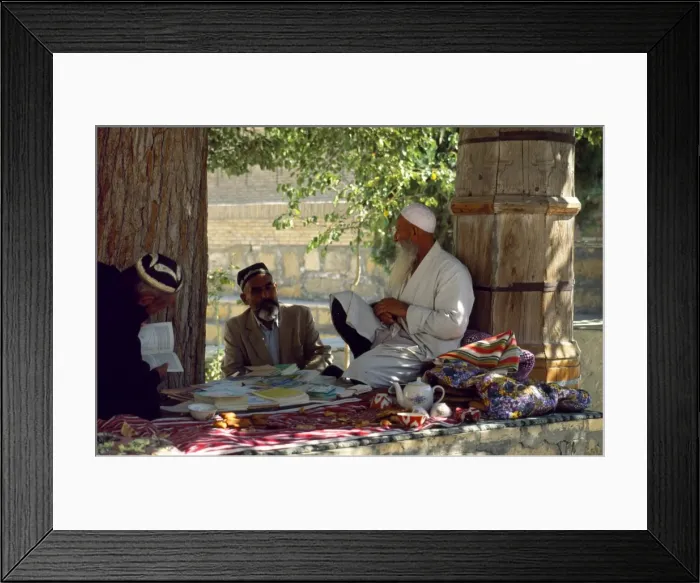 Framed Print : A mullah sits benath a tree outside the Mausoleum of Framed Print : A mullah sits benath a tree outside the Mausoleum of