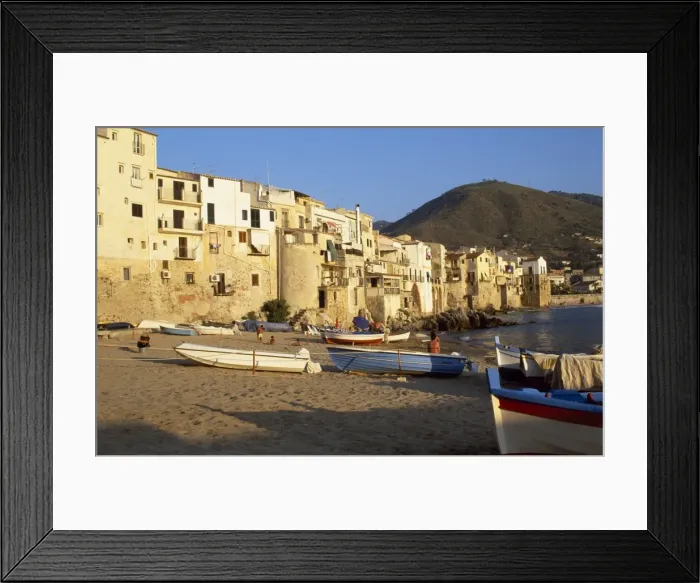 Framed Print : Fishing boats pulled up on the beach outside the old town at sunset Framed Print : Fishing boats pulled up on the beach outside the old town at sunset