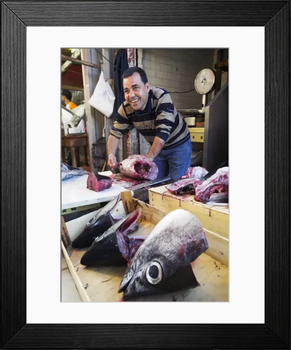 Framed Print : A fishmoger prepares fresh tuna