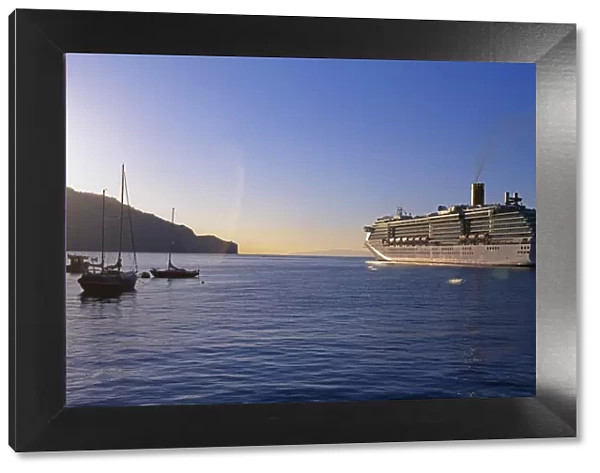 Cruise ship leaving Funchal Harbour at sunset