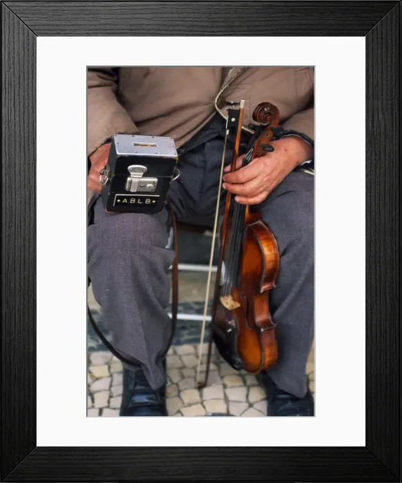 Framed Print : A blind street musician holds his violin in one hand Framed Print : A blind street musician holds his violin in one hand