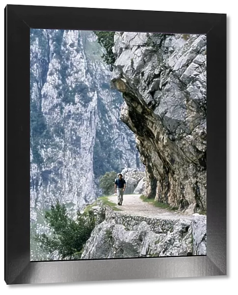 Trekker walks the trail through the Cares Gorge