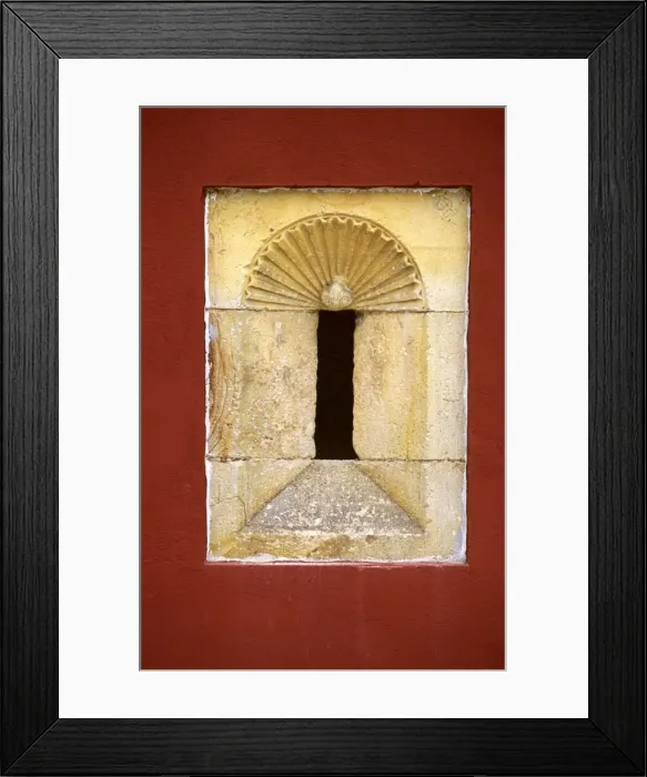 Framed Print : An old stone alcove is framed by a red painted wall in a mansion in Llanes Framed Print : An old stone alcove is framed by a red painted wall in a mansion in Llanes