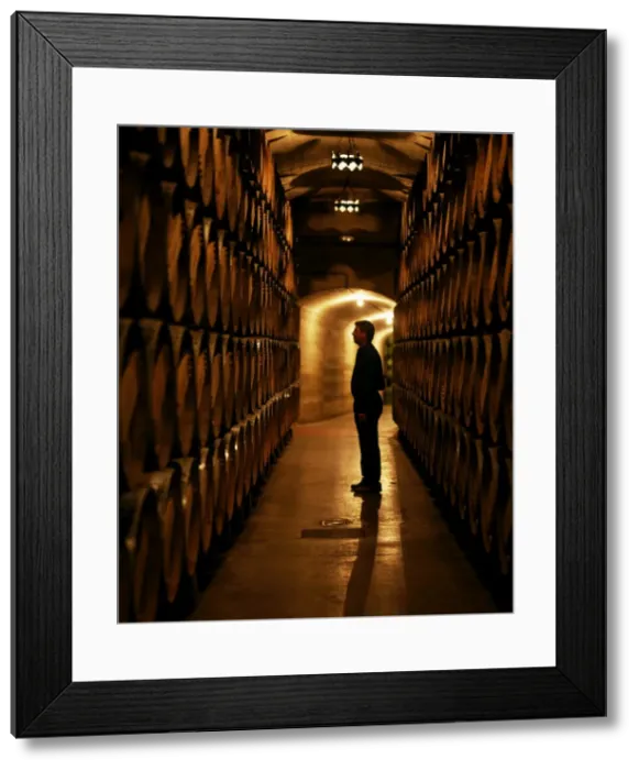 Framed Print : The foreman of works inspects barrels of Rioja wine Framed Print : The foreman of works inspects barrels of Rioja wine