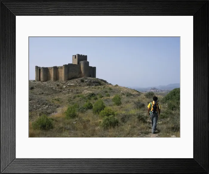 Framed Print : A walker approaches the 13th Century Castillo de Davalillo Framed Print : A walker approaches the 13th Century Castillo de Davalillo