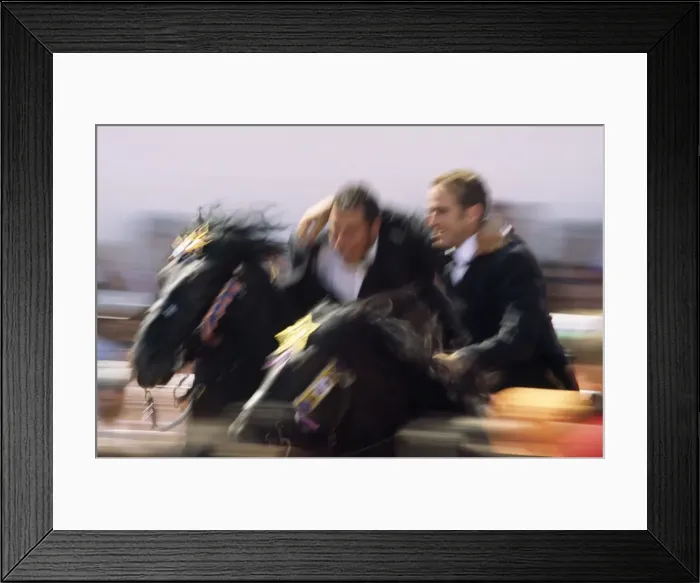 Framed Print : Two riders on horseback perform the correr abracats Framed Print : Two riders on horseback perform the correr abracats