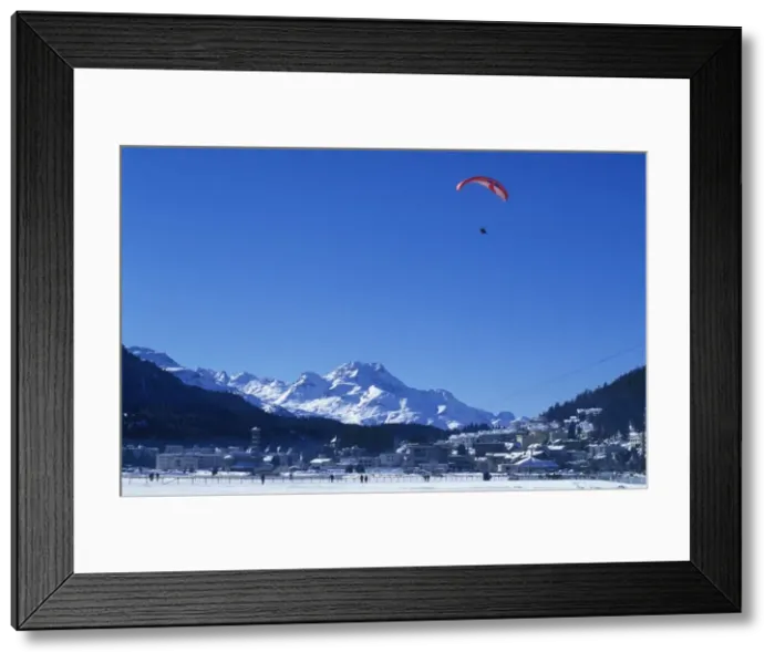Framed Print : A paraglider comes into land on the frozen Framed Print : A paraglider comes into land on the frozen