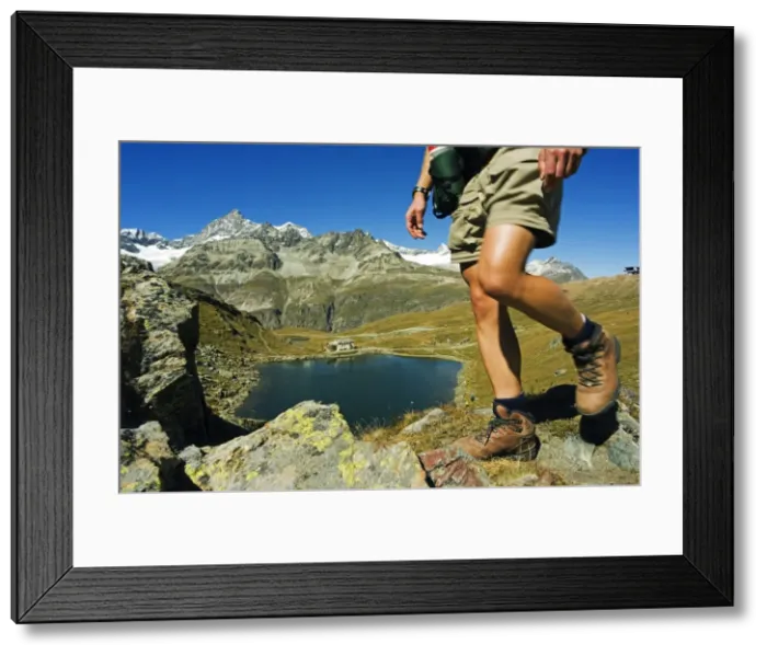 Framed Print : Hiker on trail above lake at Schwarzee Paradise (MR) Framed Print : Hiker on trail above lake at Schwarzee Paradise (MR)