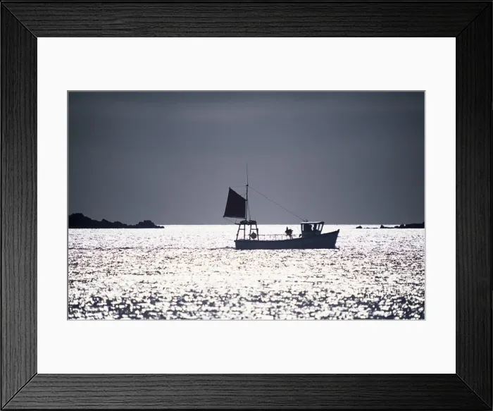 Framed Print : A silhouetted fishing boat passes the Eastern Isles Framed Print : A silhouetted fishing boat passes the Eastern Isles