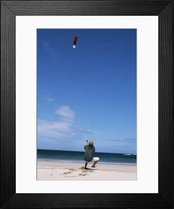 Framed Print : A boy flies a kite on one of Colls many Framed Print : A boy flies a kite on one of Colls many