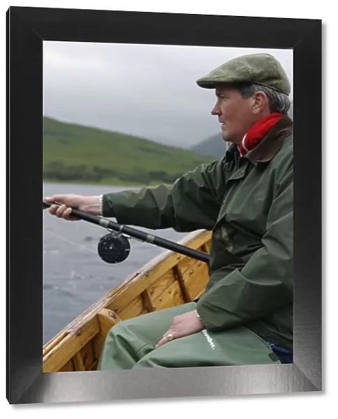 A fisherman dapping for salmon and sea trout on Loch Ba