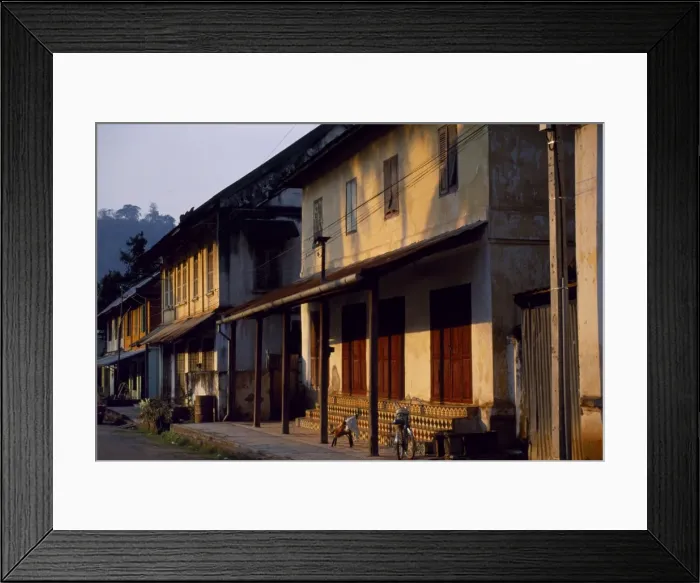 Framed Print : Old shuttered houses in the main street