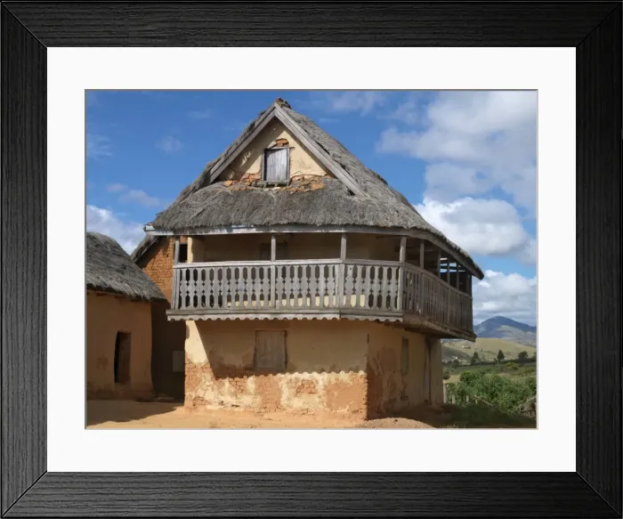 Framed Print : A typical double-storied Malagasy highland house with a carved balcony Framed Print : A typical double-storied Malagasy highland house with a carved balcony