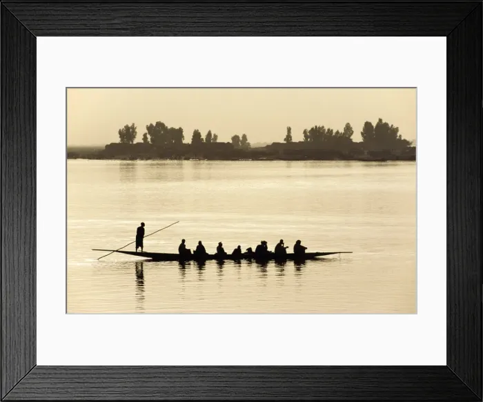 Framed Print : MALI, Mopti A pirogue loaded with passengers is poled Framed Print : MALI, Mopti A pirogue loaded with passengers is poled
