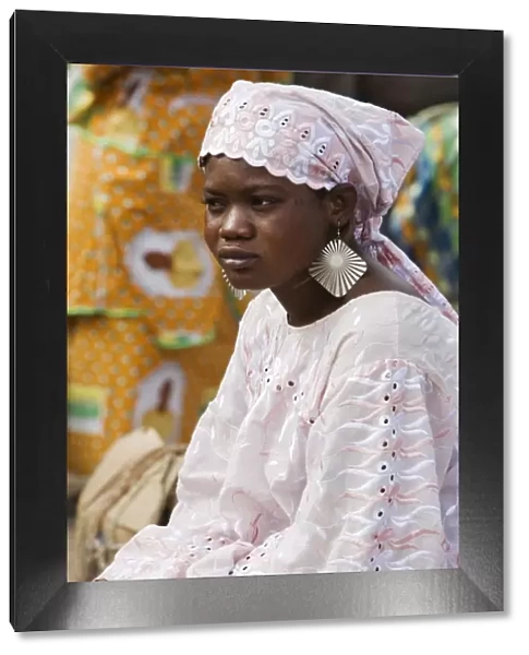Mali, DjennA Peul woman wearing large earrings at Djennarket