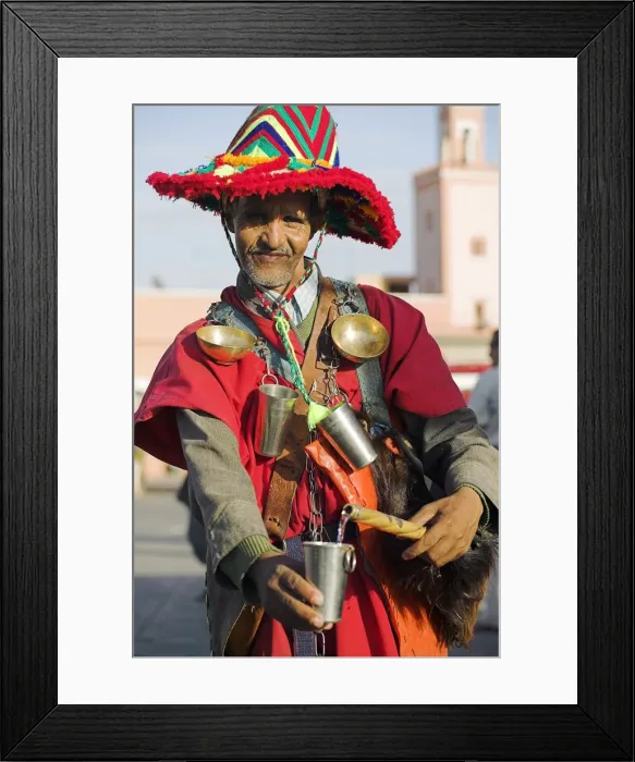 Framed Print : A Moroccan water seller in traditional dress in the Djemaa el Fna Framed Print : A Moroccan water seller in traditional dress in the Djemaa el Fna