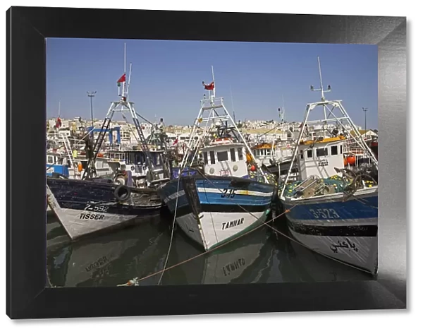 Boats moored in the busy fishing port in Tangier, Morocco